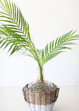 Load image into Gallery viewer, Clear Glass Bottle in Wicker Basket with Handles - 11.25&quot; Tall
