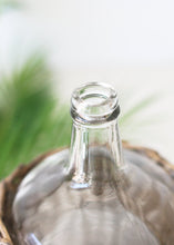 Load image into Gallery viewer, Clear Glass Bottle in Wicker Basket with Handles - 11.25&quot; Tall
